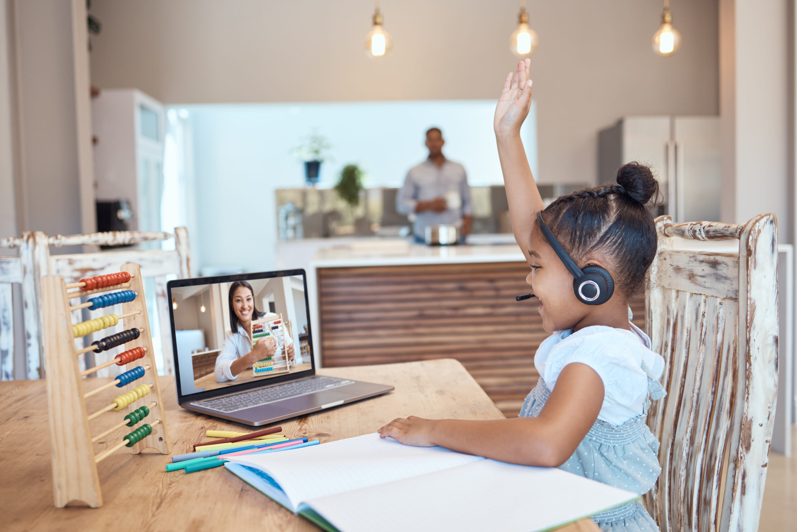 homeschool, laptop and teacher with kid, for education and teaching in home. virtual class, educator and female pupil raise hand with digital device, for lesson and elearning subjects in living room.