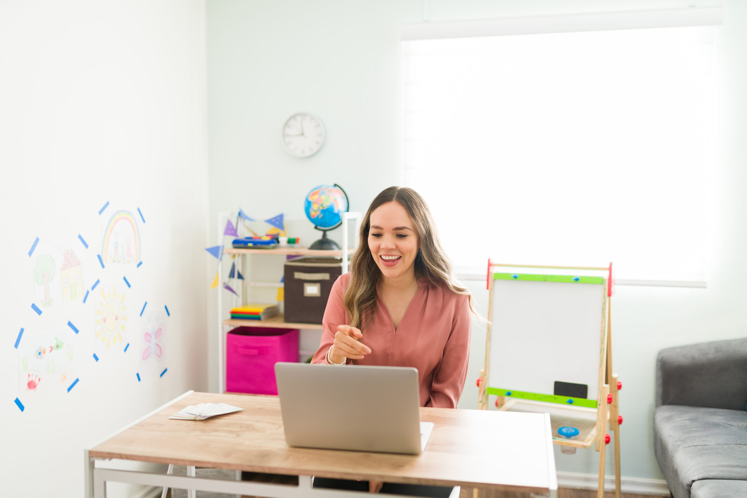 preschool teacher speaking to her students in an online class