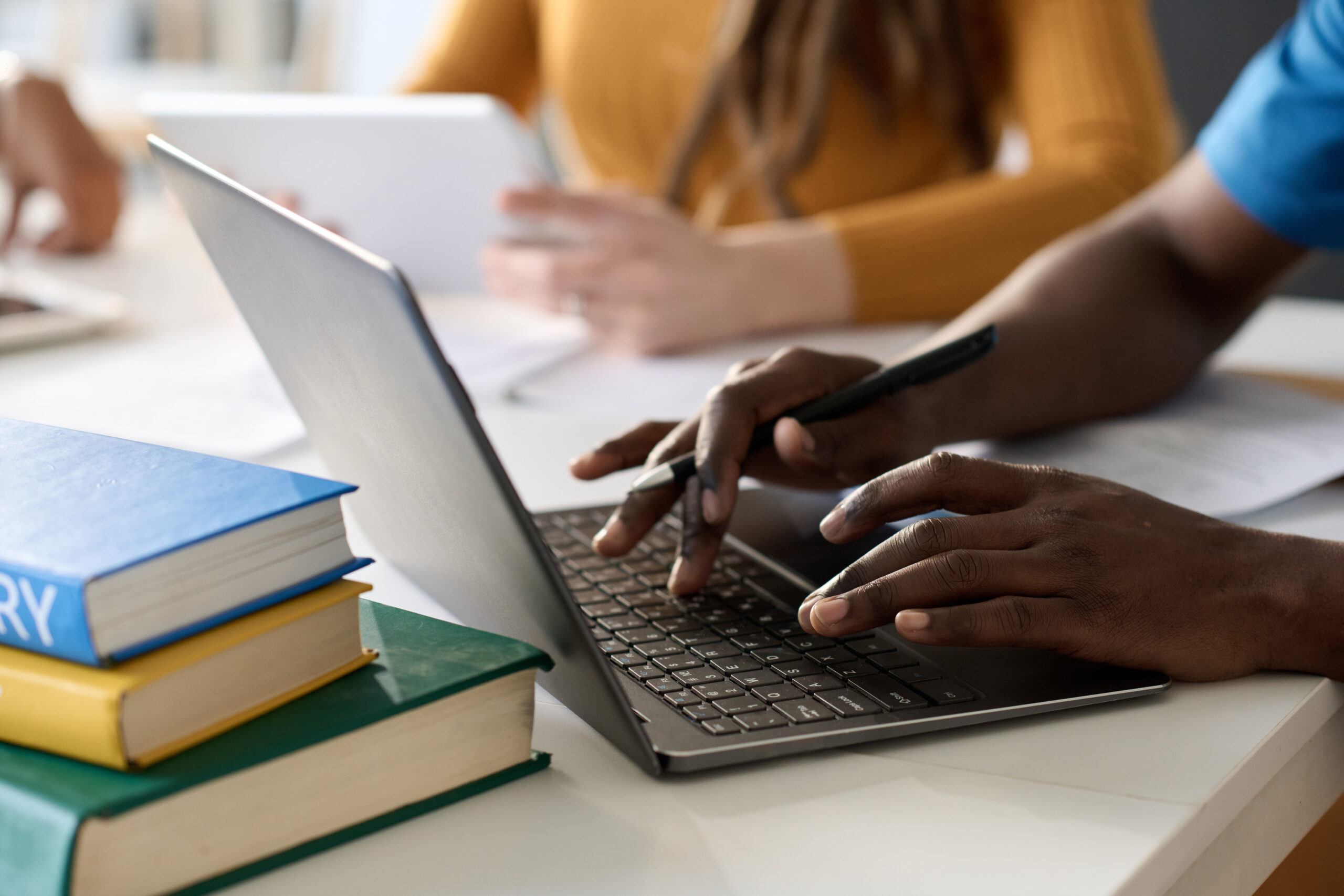 student using laptop in close up