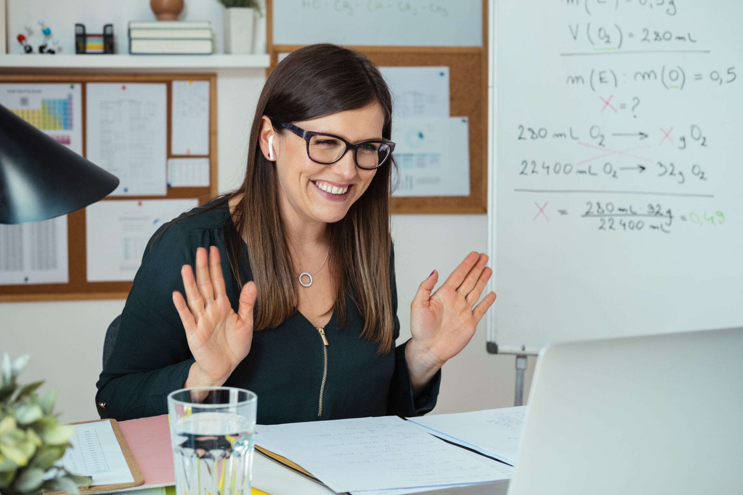 smiling online teacher say hello to classroom in video conference meeting