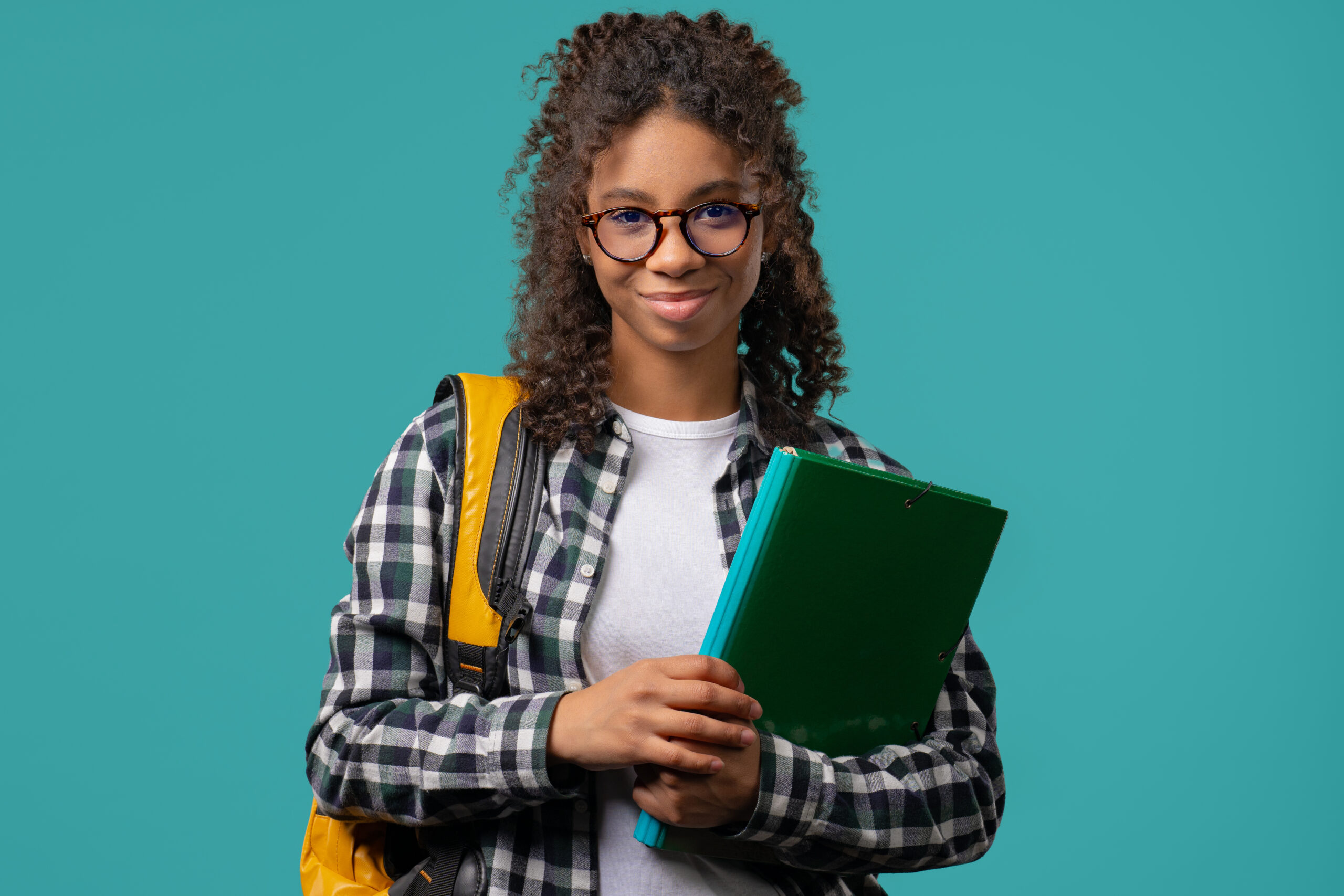 portrait of high school smiling african american student girl with papers folder. academic teen, education, university concept.