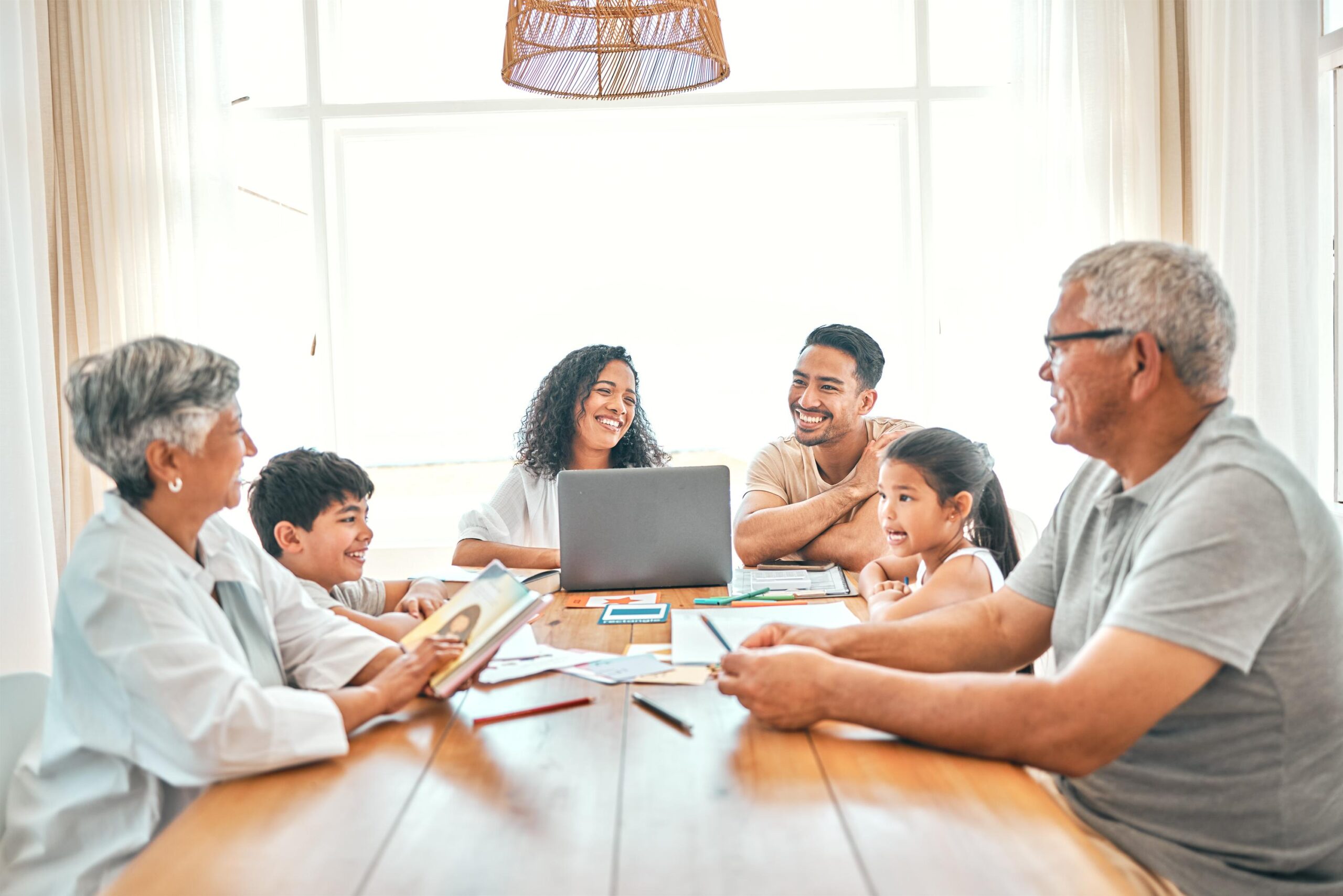 How to Choose an Accredited K-12 Virtual School in 2026 That Fits Your Family senior, black family and learning children on home laptop, reading book or storytelling help with grandparents. mexico people, mom and father with kids, online education and language development fun